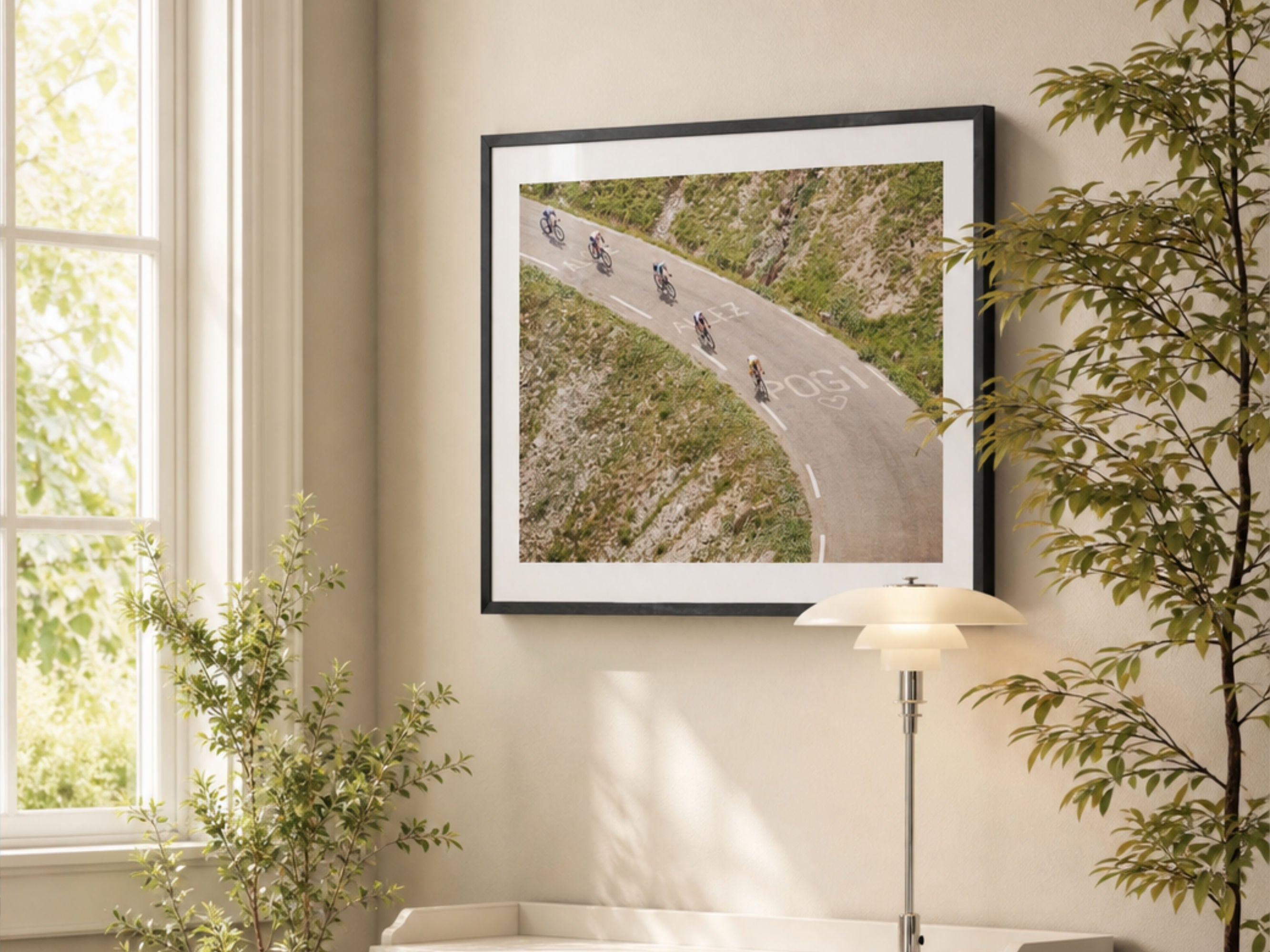 Cycling photography print of Col du Galibier descent styled in bright interior