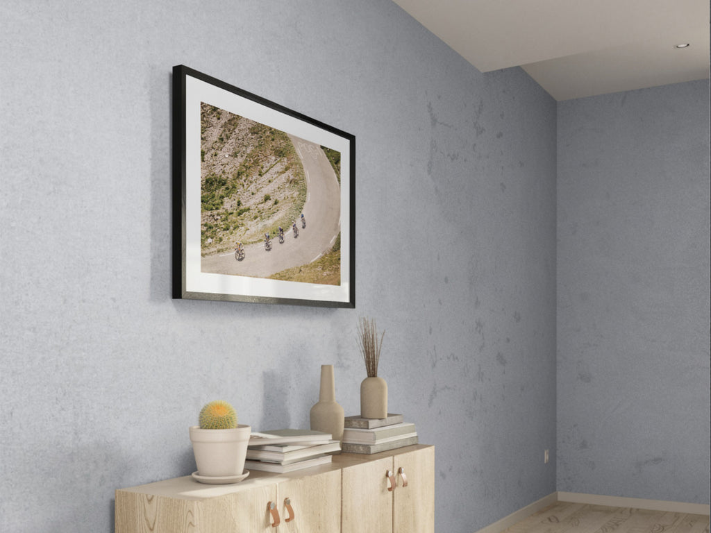 Cycling photography print of Col du Galibier descent styled in bright interior
