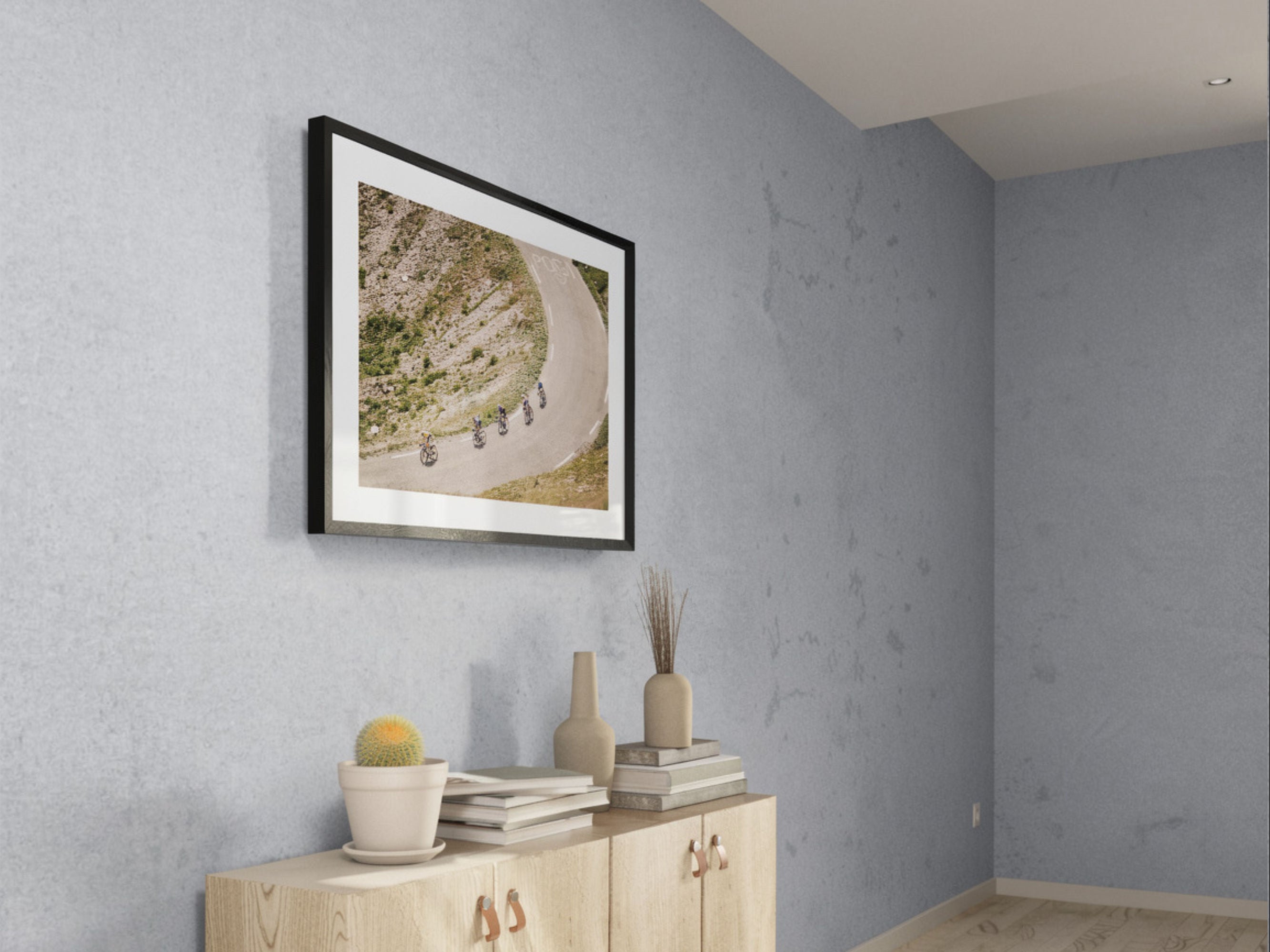 Cycling photography print of Col du Galibier descent styled in bright interior